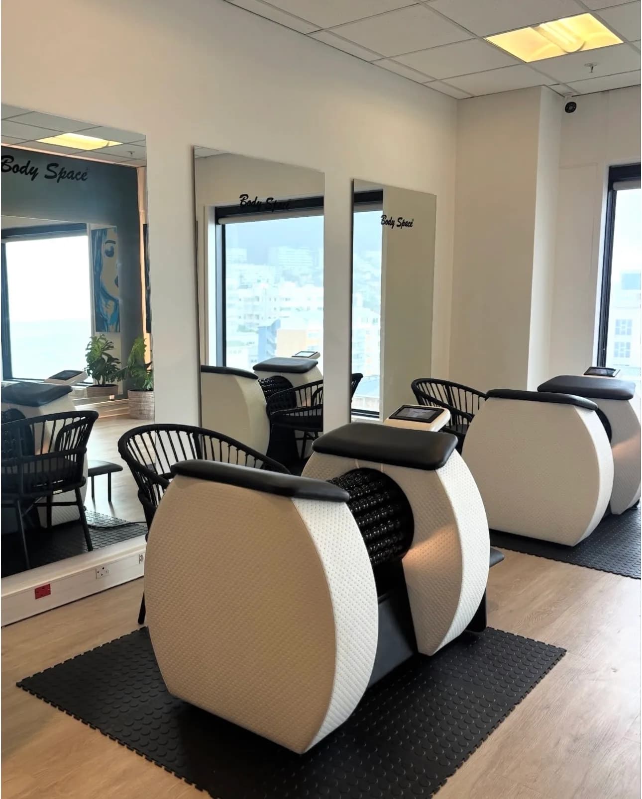 Modern Bodyroll machine in a clean, minimalist studio setting, highlighting its sleek design and advanced technology.